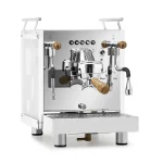 A Bezzera Matrix DE espresso machine zebra wood with its light-scattering side panels illuminated in a vibrant color, featuring rosewood handles