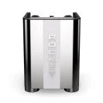 A detailed shot of the Rocket Espresso Appartamento TCA Gold E61 brew group, highlighting its new angular design with gold accents