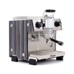 A sleek, Dalla Corte Mina Espresso Machine Blue, showcasing its distinctive manual lever (yoke) and modern design