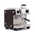 A sleek, Dalla Corte Mina Espresso Machine Dark Oak, showcasing its distinctive manual lever (yoke) and modern design