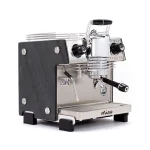 A sleek, Dalla Corte Mina Espresso Machine Stone, showcasing its distinctive manual lever (yoke) and modern design