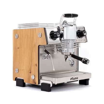 A sleek, Dalla Corte Mina Espresso Machine Wood, showcasing its distinctive manual lever (yoke) and modern design