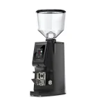 A sleek, Eureka Atom Excellence 65 Black espresso grinder on a countertop, highlighting its sturdy build