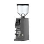 A sleek, Eureka Atom Excellence 65 Grey espresso grinder on a countertop, highlighting its sturdy build