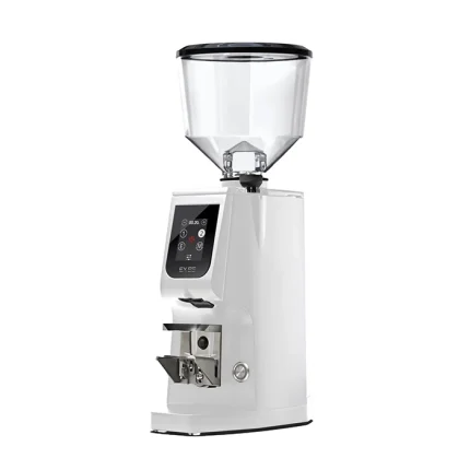 A sleek, Eureka Atom Excellence 65 White espresso grinder on a countertop, highlighting its sturdy build