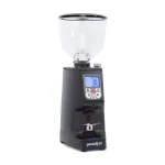 A sleek, Eureka Atom Specialty 65 black espresso grinder on a kitchen counter, highlighting its compact design