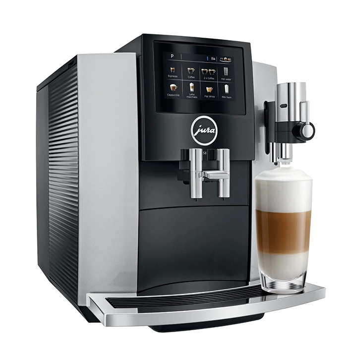 A sleek JURA S8 espresso machine silver, displaying its large color touchscreen and a coffee cup ready for brewing