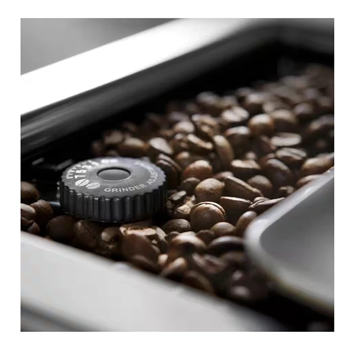 A view of the bean hopper and integrated conical burr grinder on the DeLonghi PrimaDonna Elite A view of the bean hopper and integrated conical burr grinder on the DeLonghi PrimaDonna Elite