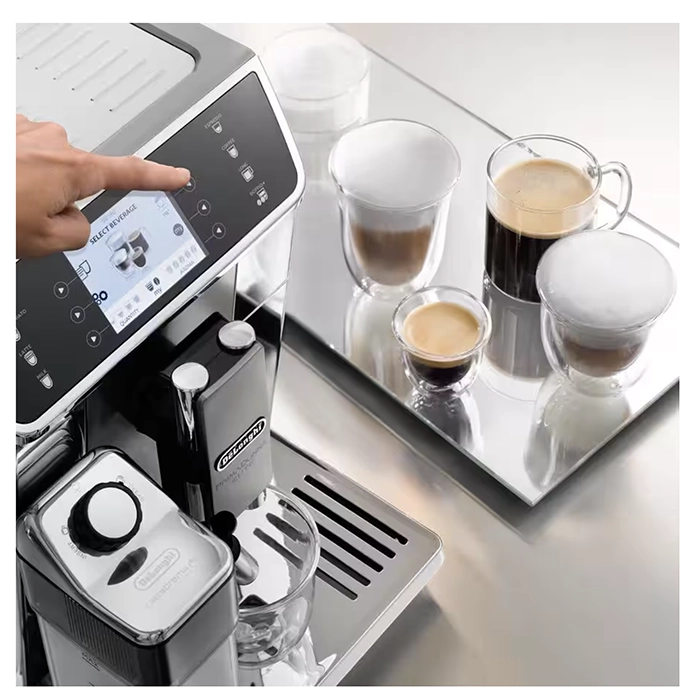 Close-up of the LatteCrema System milk carafe attached to the DeLonghi PrimaDonna Elite, highlighting its automatic frothing Close-up of the LatteCrema System milk carafe attached to the DeLonghi PrimaDonna Elite, highlighting its automatic frothing