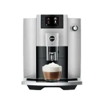 Front view of the sleek JURA E6 espresso machine Platinum, highlighting its display and spouts